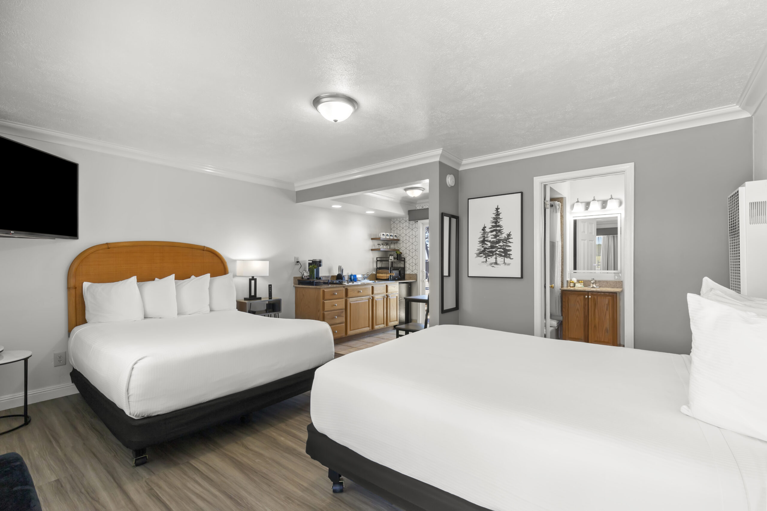 First Floor w/ View, Sliding Door to BBQ Deck. This room has a more distant view with tables, umbrellas and chairs. Sit and relax on the deck. 